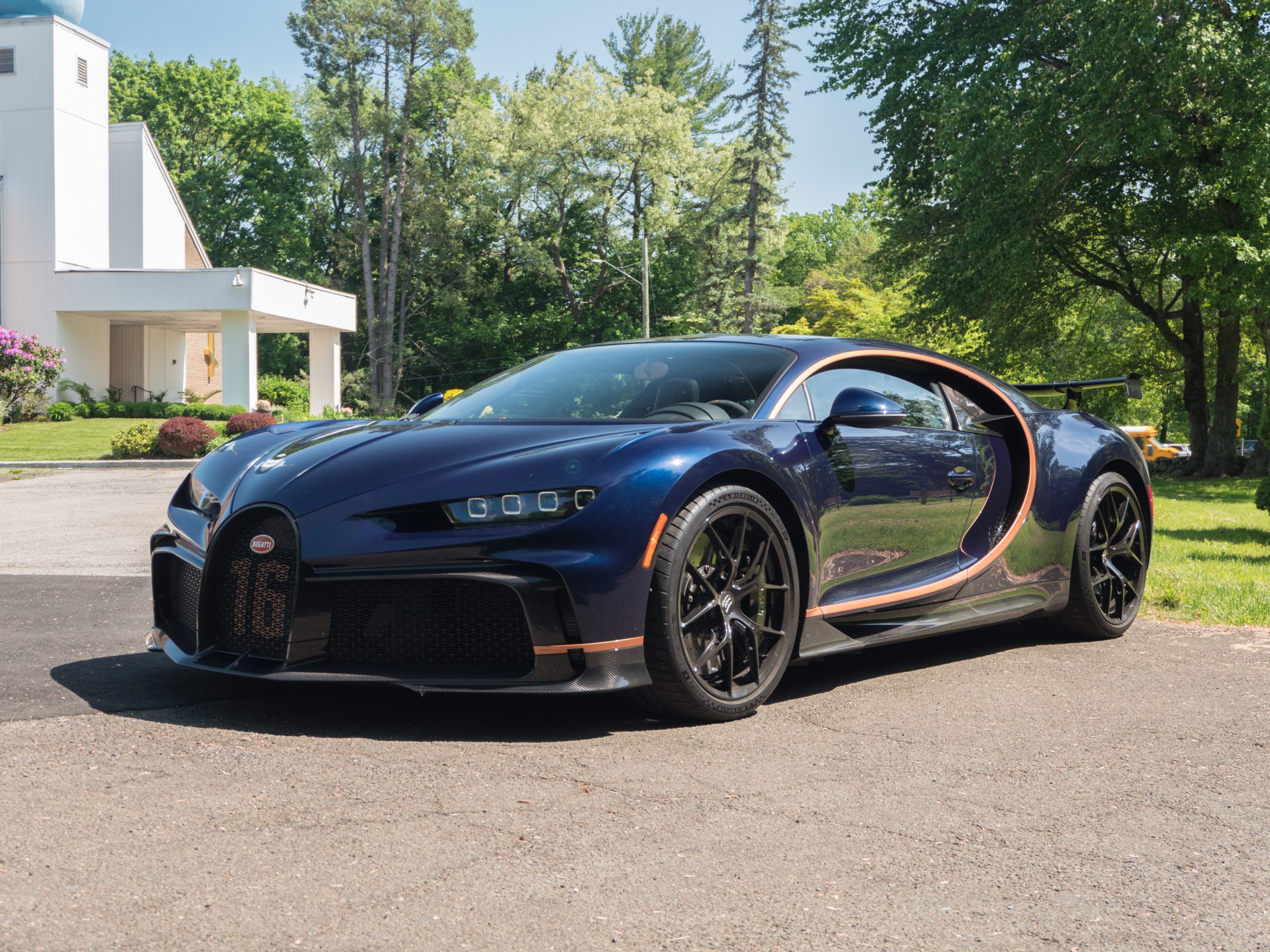 Bugatti Chiron hypercar parked at a sunset-lit villa in Ibiza – ultimate luxury rental by King Luxury Ibiza
