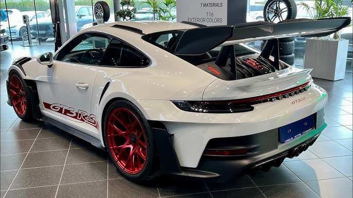Porsche 911 GT3 RS in matte black parked at Ibiza marina – track-ready luxury rental by King Luxury Ibiza